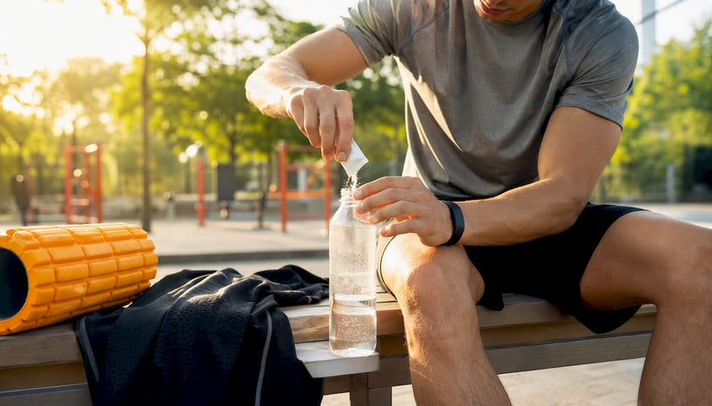 Athlete preparing recovery drink post-game